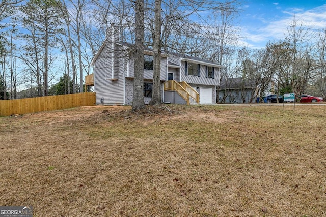 8443 Park Ridge Ln, Riverdale, GA 30274 - view of front of home with an attached garage, fence, a front lawn, and a chimney