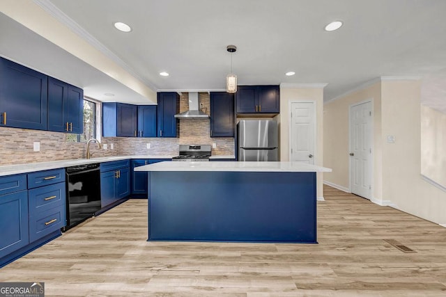 8443 Park Ridge Ln, Riverdale, GA 30274 - kitchen with light countertops, wall chimney exhaust hood, blue cabinets, a center island, and stainless steel appliances