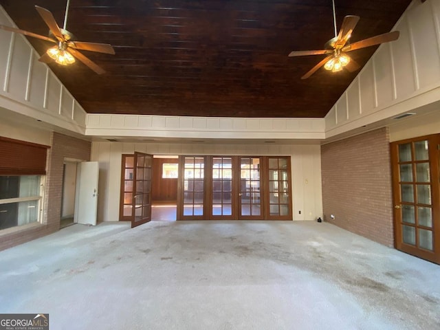 608 Pine Point Ct, Valdosta, GA 31602 - unfurnished living room featuring carpet flooring, high vaulted ceiling, french doors, and a ceiling fan
