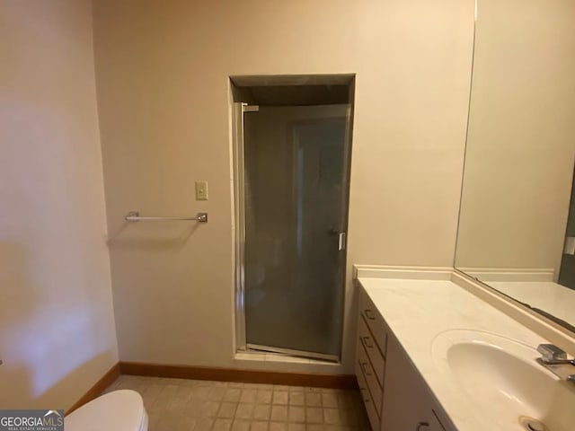 608 Pine Point Ct, Valdosta, GA 31602 - full bathroom featuring toilet, vanity, a stall shower, and baseboards