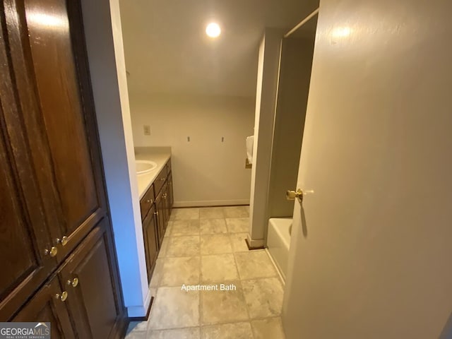 608 Pine Point Ct, Valdosta, GA 31602 - full bath featuring a bathing tub, vanity, tile patterned flooring, walk in shower, and baseboards