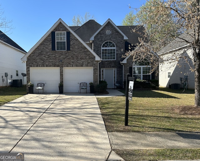 traditional-style home featuring brick siding, a front yard, driveway, and central air condition unit