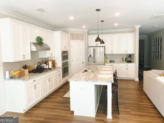 5745 Pickens Garden Ln, Powder Springs, GA 30127 - kitchen featuring stainless steel appliances, exhaust hood, crown molding, decorative backsplash, and a kitchen bar