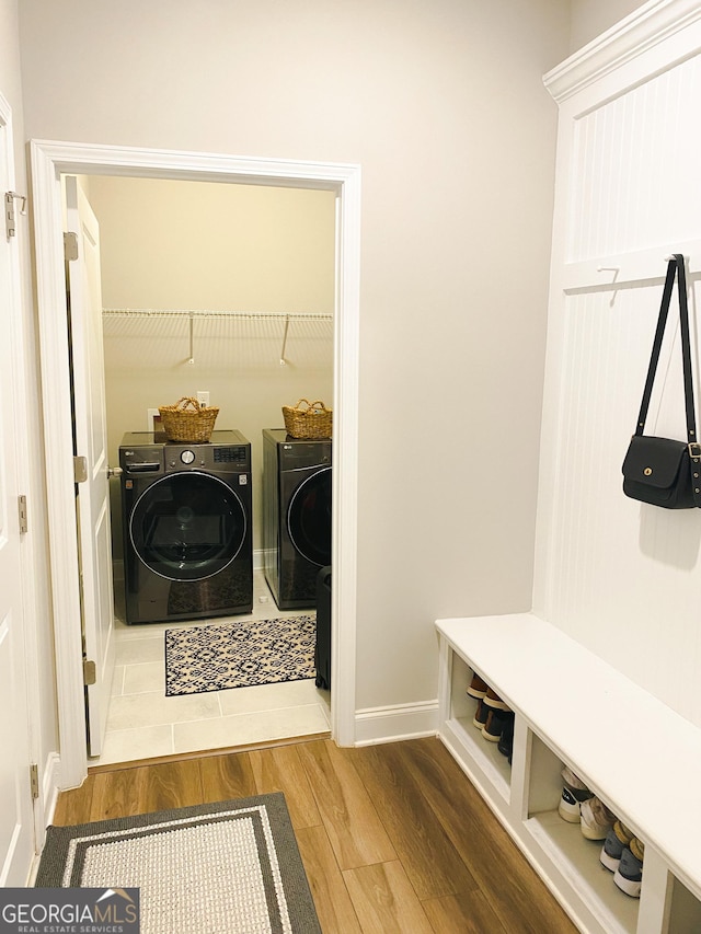 5745 Pickens Garden Ln, Powder Springs, GA 30127 - laundry area featuring washer and clothes dryer and wood finished floors