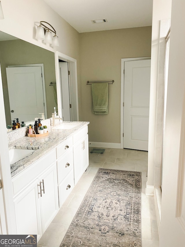 5745 Pickens Garden Ln, Powder Springs, GA 30127 - full bath featuring double vanity and tile patterned flooring