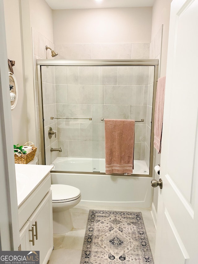 5745 Pickens Garden Ln, Powder Springs, GA 30127 - full bathroom featuring vanity, combined bath / shower with glass door, and tile patterned flooring