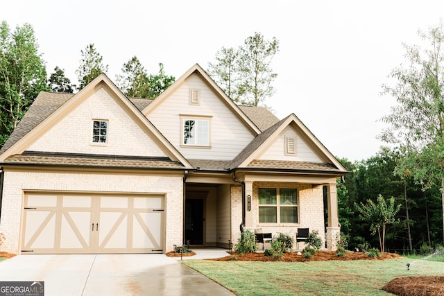 5745 Pickens Garden Ln, Powder Springs, GA 30127 - view of front facade featuring brick siding, concrete driveway, a front lawn, and roof with shingles