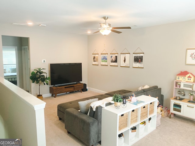 5745 Pickens Garden Ln, Powder Springs, GA 30127 - living area featuring light carpet and a ceiling fan