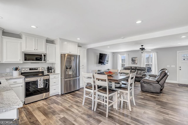 58 Estate Dr, Dahlonega, GA 30533 - kitchen featuring stainless steel appliances, light wood-type flooring, white cabinetry, recessed lighting, and open floor plan