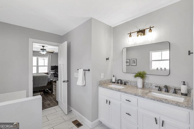 58 Estate Dr, Dahlonega, GA 30533 - ensuite bathroom with baseboards, a ceiling fan, double vanity, and marble finish floors