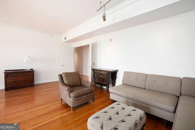 195 14th St NE Ph 306, Atlanta, GA 30309 - living room with ornamental molding, wood finished floors, and baseboards