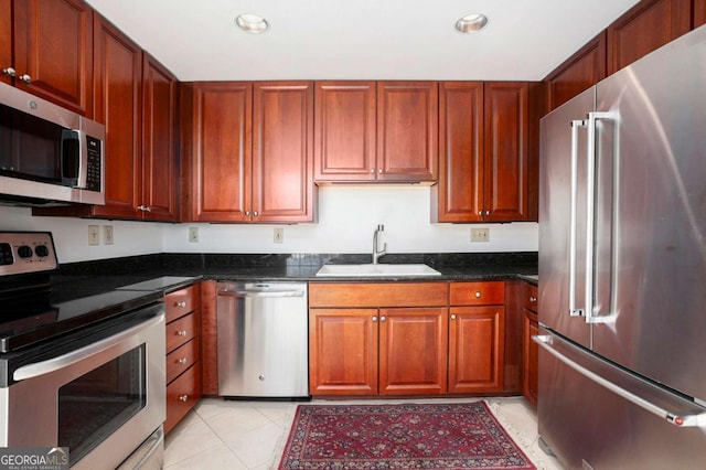195 14th St NE Ph 306, Atlanta, GA 30309 - kitchen with appliances with stainless steel finishes, a sink, recessed lighting, light tile patterned flooring, and dark stone countertops