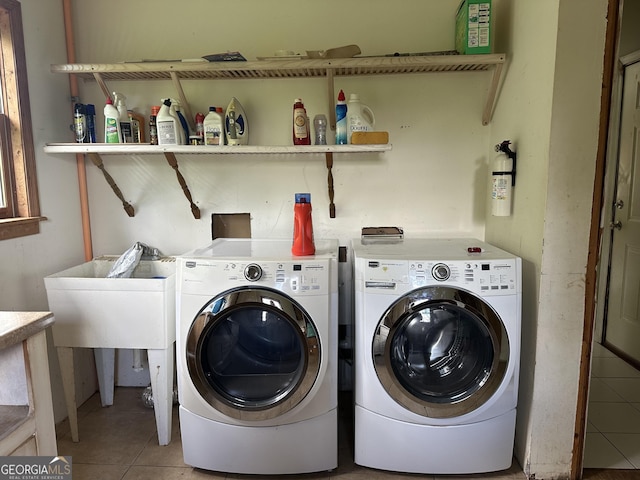 78 Ramblin Rose Ln, Rabun Gap, GA 30568 - washroom with washer and clothes dryer and light tile patterned floors