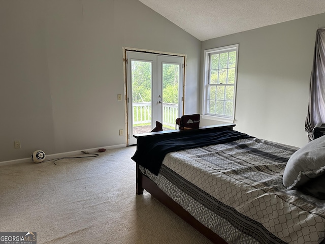 78 Ramblin Rose Ln, Rabun Gap, GA 30568 - bedroom featuring french doors, access to outside, carpet floors, vaulted ceiling, and baseboards