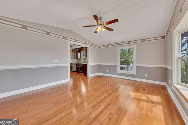 2285 Bascomb Carmel Rd, Woodstock, GA 30189 - spare room with vaulted ceiling, ceiling fan, and light wood-type flooring
