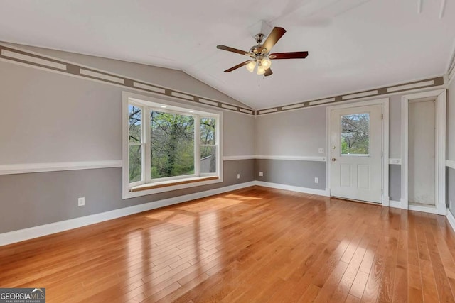 2285 Bascomb Carmel Rd, Woodstock, GA 30189 - empty room featuring ceiling fan, wood-type flooring, and lofted ceiling