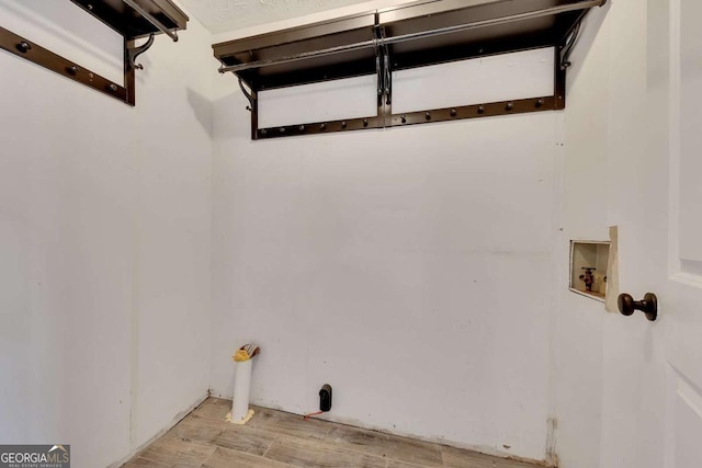2285 Bascomb Carmel Rd, Woodstock, GA 30189 - laundry room featuring light wood-style floors and washer hookup