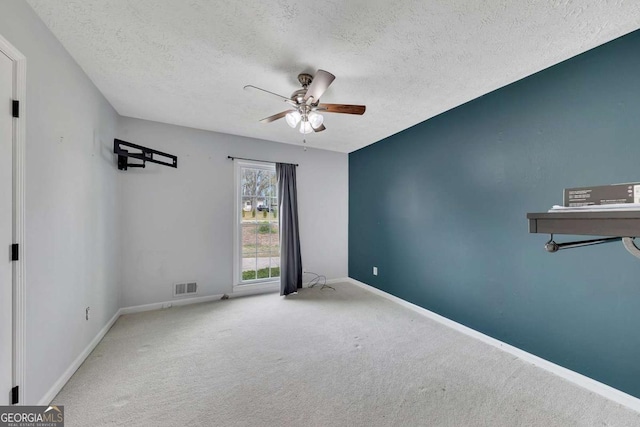 2285 Bascomb Carmel Rd, Woodstock, GA 30189 - carpeted spare room with ceiling fan and a textured ceiling