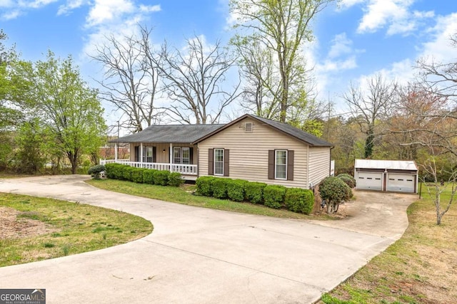 2285 Bascomb Carmel Rd, Woodstock, GA 30189 - ranch-style house featuring a porch, an outdoor structure, a detached garage, and concrete driveway