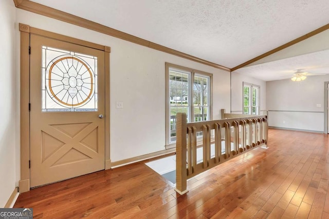 2285 Bascomb Carmel Rd, Woodstock, GA 30189 - foyer entrance featuring a textured ceiling, hardwood / wood-style flooring, crown molding, and lofted ceiling