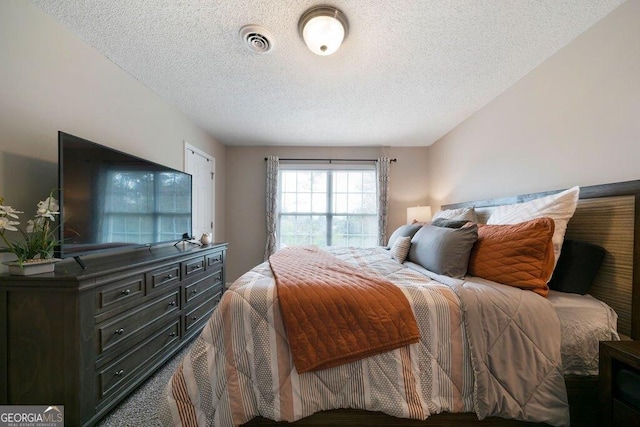 413 W I Pkwy, Dallas, GA 30132 - bedroom with visible vents and a textured ceiling