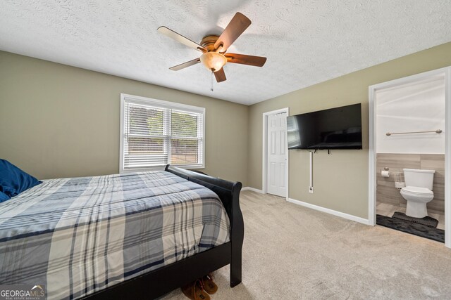 bedroom with carpet, baseboards, a ceiling fan, and a textured ceiling