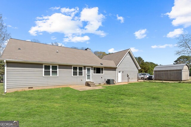 rear view of property with a chimney, crawl space, and central air condition unit