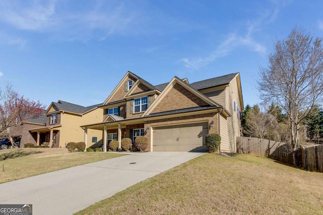 3475 Summerlin Pkwy, Lithia Springs, GA 30122 - view of front of home featuring concrete driveway, fence, an attached garage, a front lawn, and brick siding