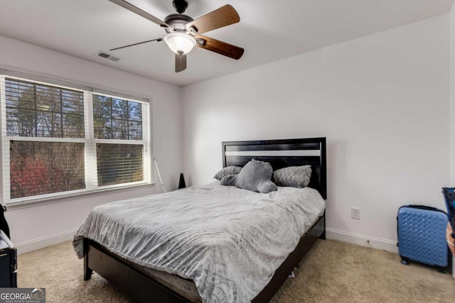 3475 Summerlin Pkwy, Lithia Springs, GA 30122 - carpeted bedroom featuring baseboards, visible vents, and ceiling fan