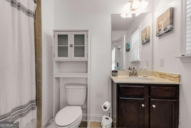 3475 Summerlin Pkwy, Lithia Springs, GA 30122 - full bathroom with a shower with curtain, toilet, vanity, and baseboards