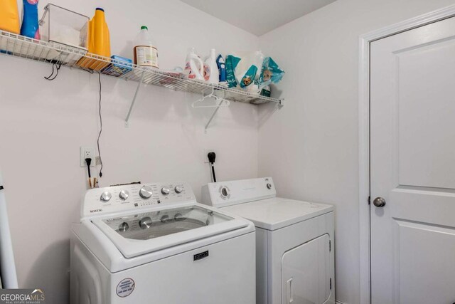 3475 Summerlin Pkwy, Lithia Springs, GA 30122 - washroom with laundry area and washer and clothes dryer