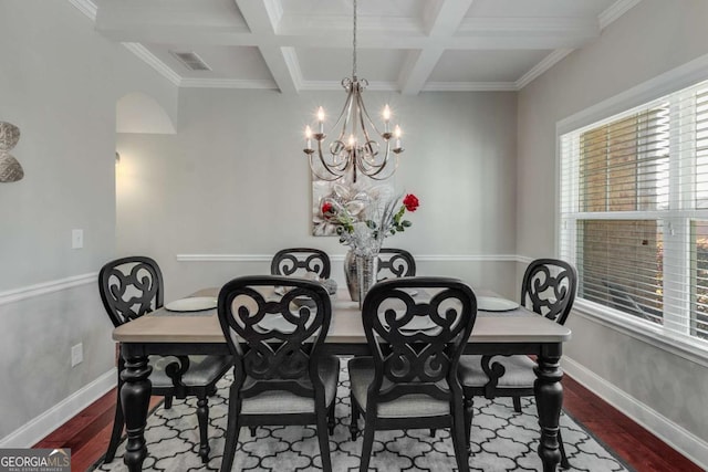 3475 Summerlin Pkwy, Lithia Springs, GA 30122 - dining room featuring baseboards, visible vents, wood finished floors, and a notable chandelier