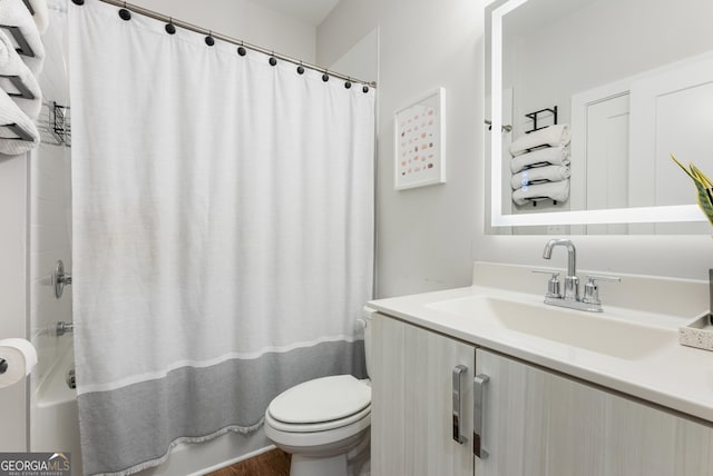 full bath featuring shower / bath combo, toilet, and vanity
