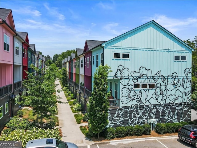 exterior space with a residential view and uncovered parking