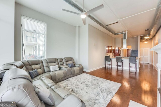 3820 Roswell Rd NE Unit 902, Atlanta, GA 30342 - living area with dark wood finished floors, baseboards, and ceiling fan