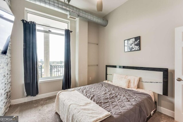3820 Roswell Rd NE Unit 902, Atlanta, GA 30342 - bedroom featuring baseboards and carpet flooring