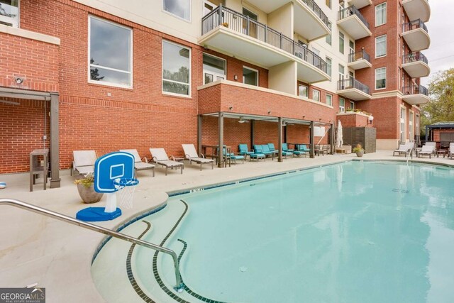 3820 Roswell Rd NE Unit 902, Atlanta, GA 30342 - community pool featuring a patio
