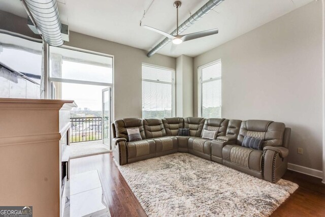 3820 Roswell Rd NE Unit 902, Atlanta, GA 30342 - living area featuring a ceiling fan, dark wood-type flooring, and a healthy amount of sunlight