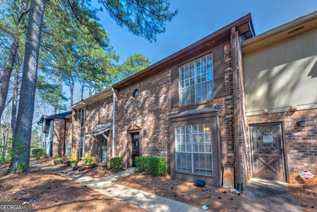 view of front of home featuring brick siding