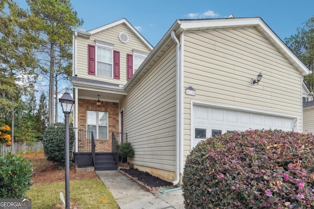 810 Abbotts Mill Ct Unit 83, Duluth, GA 30097 - view of front facade with brick siding and fence