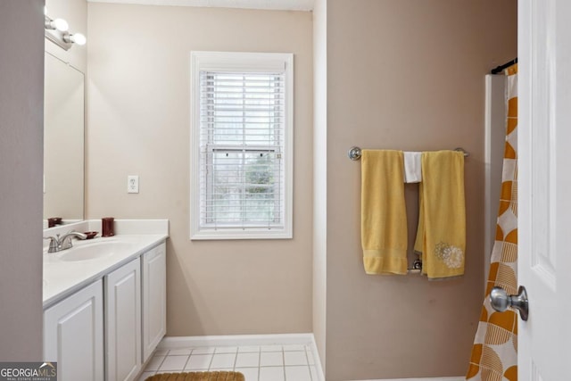 810 Abbotts Mill Ct Unit 83, Duluth, GA 30097 - bathroom with baseboards, tile patterned floors, and vanity
