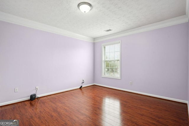 810 Abbotts Mill Ct Unit 83, Duluth, GA 30097 - empty room with ornamental molding, baseboards, a textured ceiling, visible vents, and wood finished floors