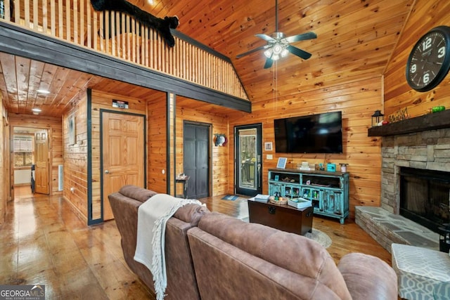 27 Alpine Dr Unit 3625, Ellijay, GA 30540 - living room with wooden walls, hardwood / wood-style floors, wooden ceiling, a ceiling fan, and a fireplace