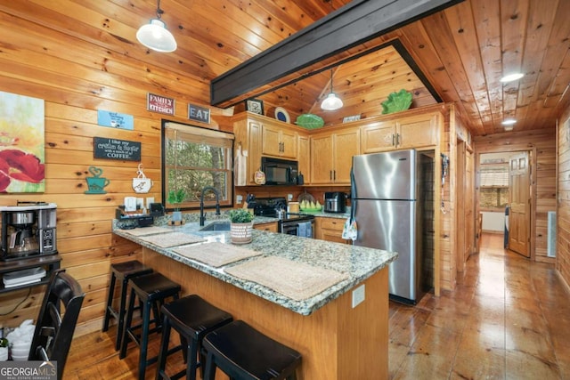 27 Alpine Dr Unit 3625, Ellijay, GA 30540 - kitchen with black appliances, wooden walls, wooden ceiling, wood-type flooring, and a peninsula