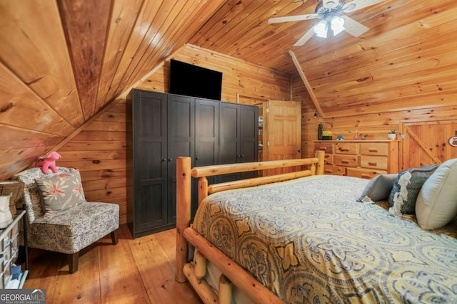 27 Alpine Dr Unit 3625, Ellijay, GA 30540 - bedroom featuring vaulted ceiling, wood walls, wood ceiling, light wood-type flooring, and a ceiling fan