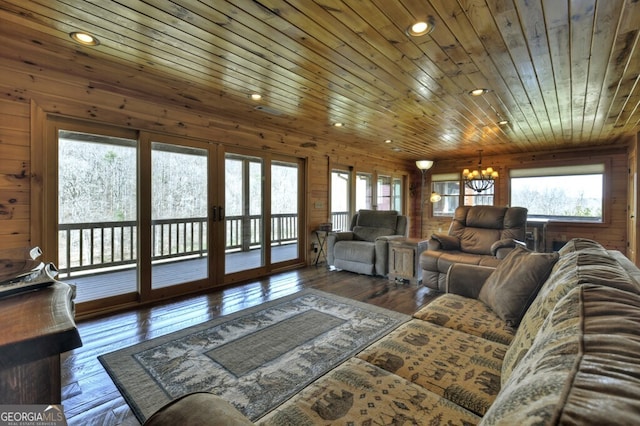 living room featuring recessed lighting, wooden ceiling, french doors, a notable chandelier, and hardwood / wood-style flooring