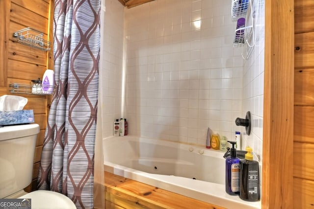 full bathroom with a combined bath / shower with jetted tub and toilet