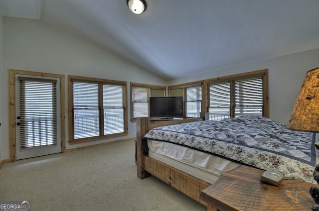 carpeted bedroom with multiple windows, baseboards, and lofted ceiling