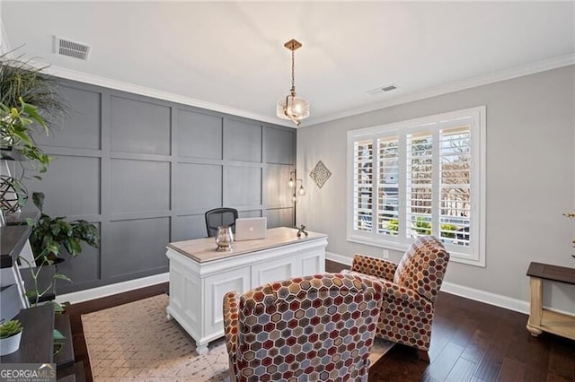 office space featuring dark wood-style floors, visible vents, ornamental molding, and a decorative wall