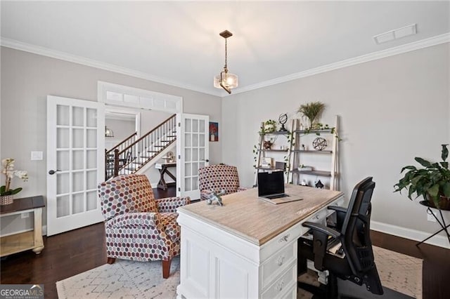 home office with french doors, wood finished floors, baseboards, visible vents, and ornamental molding